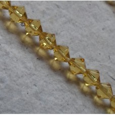 Glass beads ~ Bicone Light Gold